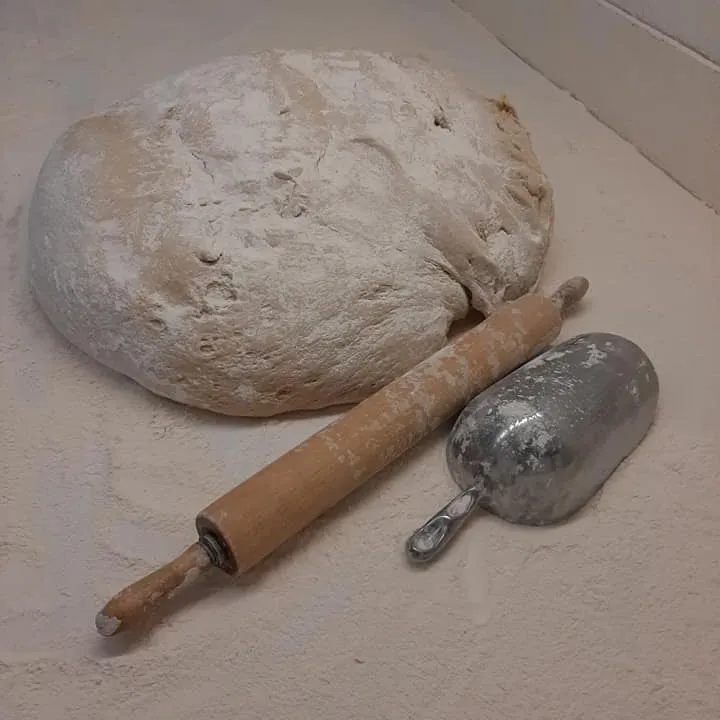 Fresh bread dough and rolling pin, Bea's makes everything from scratch